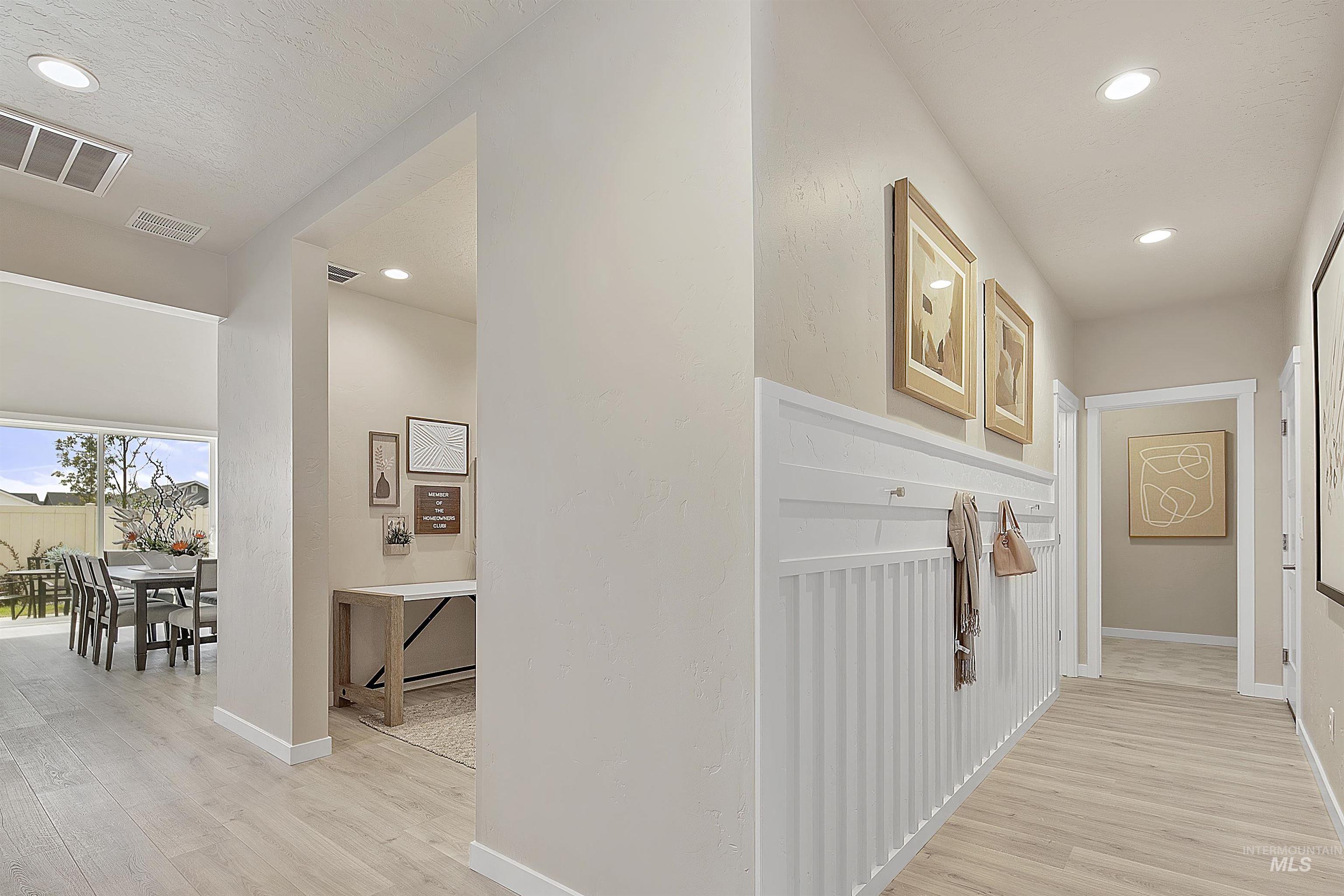 7795 East Meriwether Drive Nampa, ID 83687 - Photo 4 of 10 Hallway with light wood-type flooring and recessed lighting