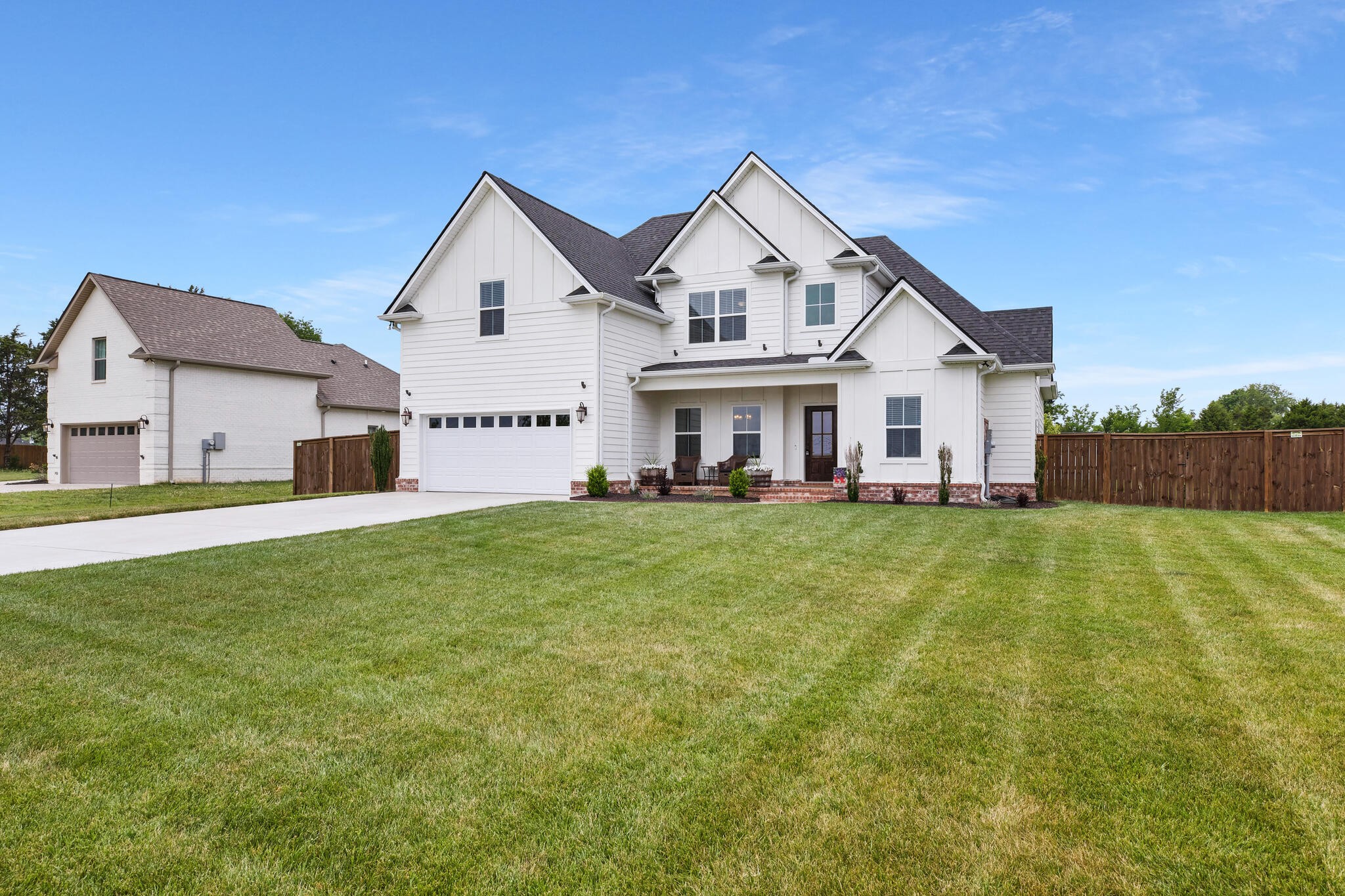 6570 Murfreesboro Road Lebanon, TN 37090 - Photo 2 of 28 a view of a house with a big yard and large trees