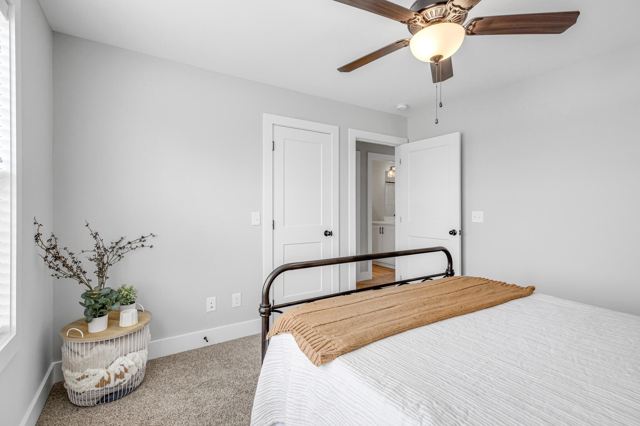 6570 Murfreesboro Road Lebanon, TN 37090 - Photo 21 of 28 a bedroom with a bed and a potted plant