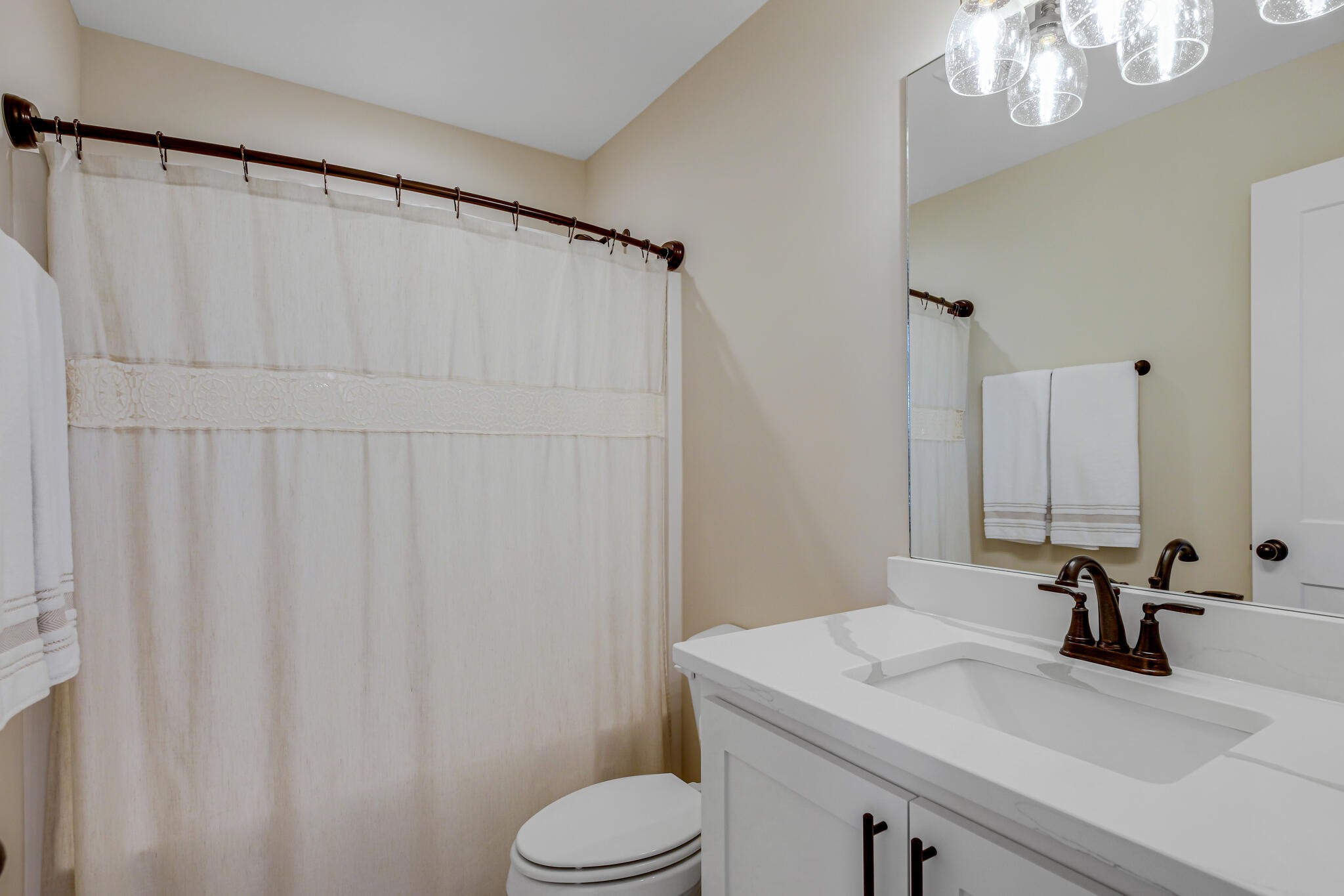 6570 Murfreesboro Road Lebanon, TN 37090 - Photo 22 of 28 a bathroom with a sink a toilet and mirror