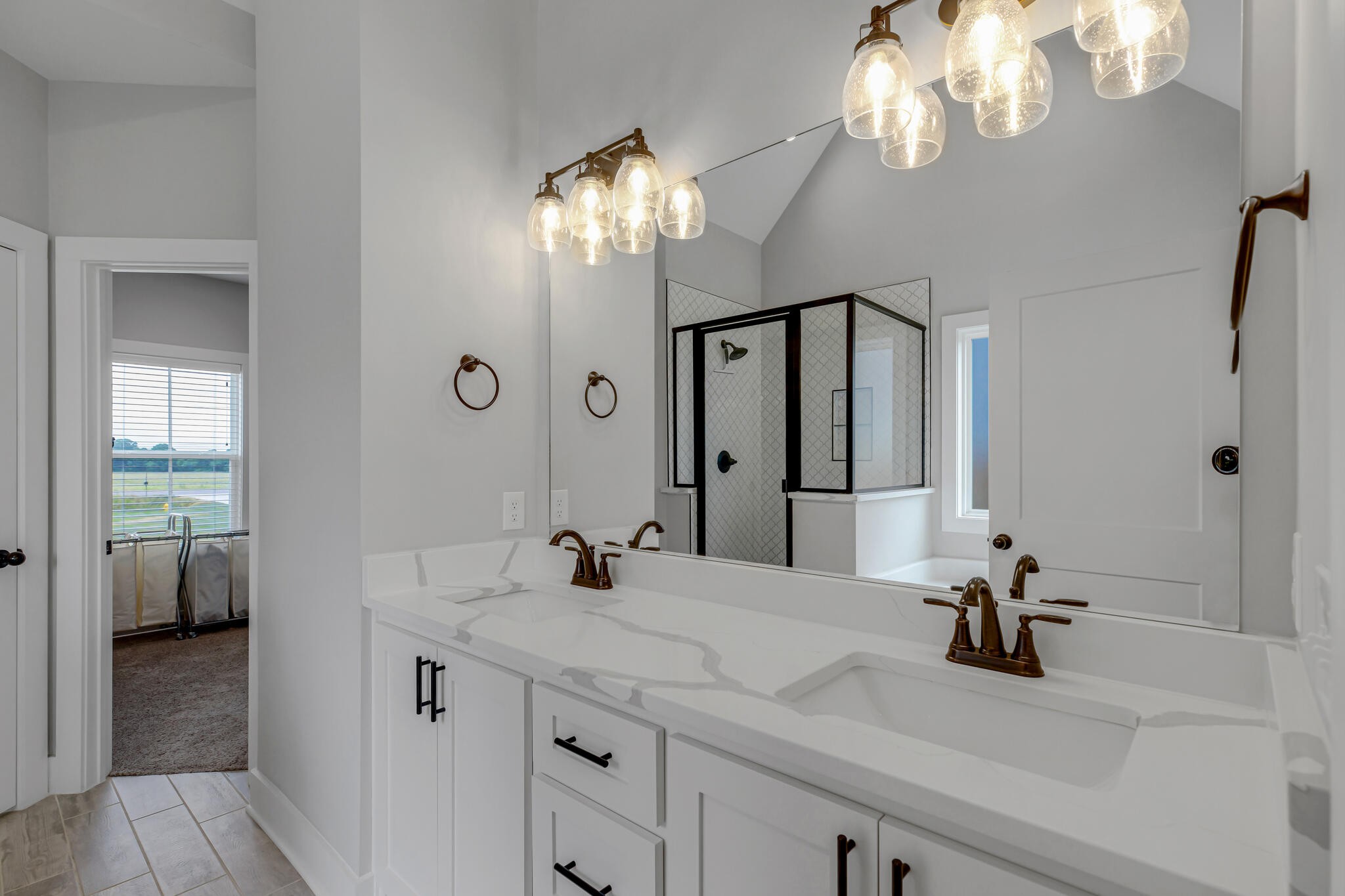 6570 Murfreesboro Road Lebanon, TN 37090 - Photo 8 of 28 a bathroom with a sink a large mirror and a shower