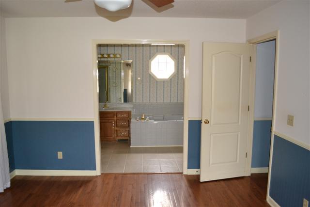 98 River Forge Road Manchester, TN 37355 - Photo 8 of 18 Large master bedroom on the main floor with hardwood floors