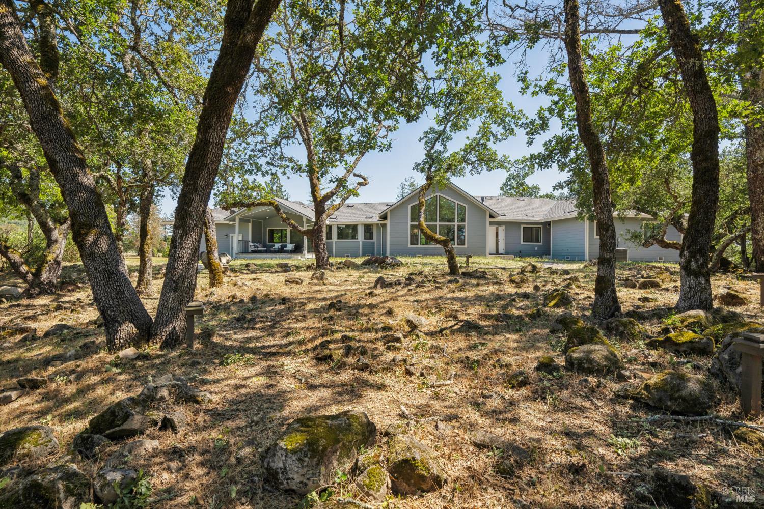 4665 Upper Ridge Road Santa Rosa, CA 95404 - Photo 44 of 71 a front view of a house with a yard