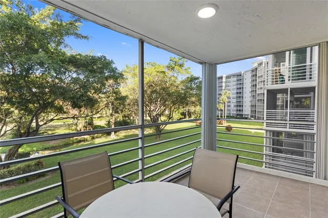 a view of a two chairs in the balcony