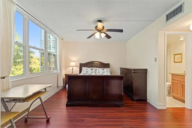 a view of a livingroom with furniture and a window