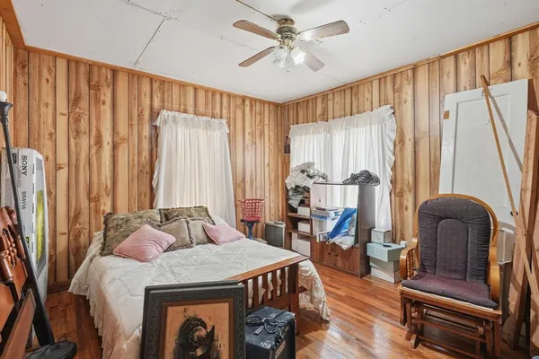 a bedroom with furniture and a chandelier
