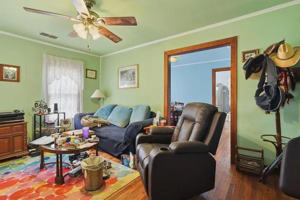 a living room with furniture and a window