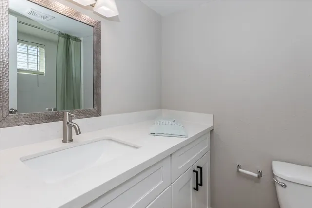 a bathroom with a sink and a toilet