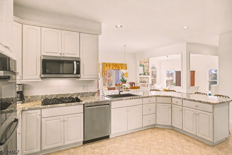 2 Moonlight Trail Flemington, NJ 08822 - Photo 11 of 50 a kitchen with a sink stove and cabinets