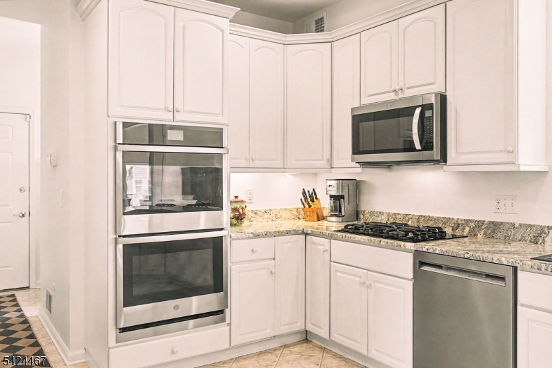 2 Moonlight Trail Flemington, NJ 08822 - Photo 12 of 50 a kitchen with granite countertop white cabinets stainless steel appliances and a sink