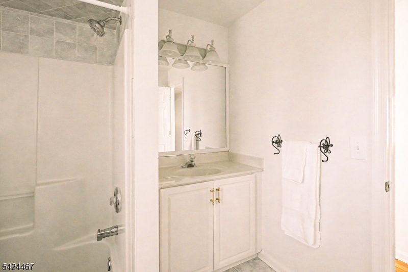 2 Moonlight Trail Flemington, NJ 08822 - Photo 41 of 50 a bathroom with a granite countertop sink a mirror and shower