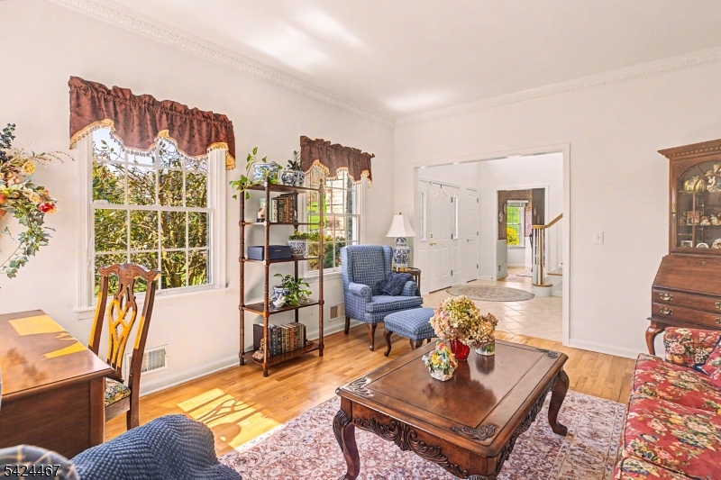 2 Moonlight Trail Flemington, NJ 08822 - Photo 7 of 50 a living room with furniture a rug and a chandelier