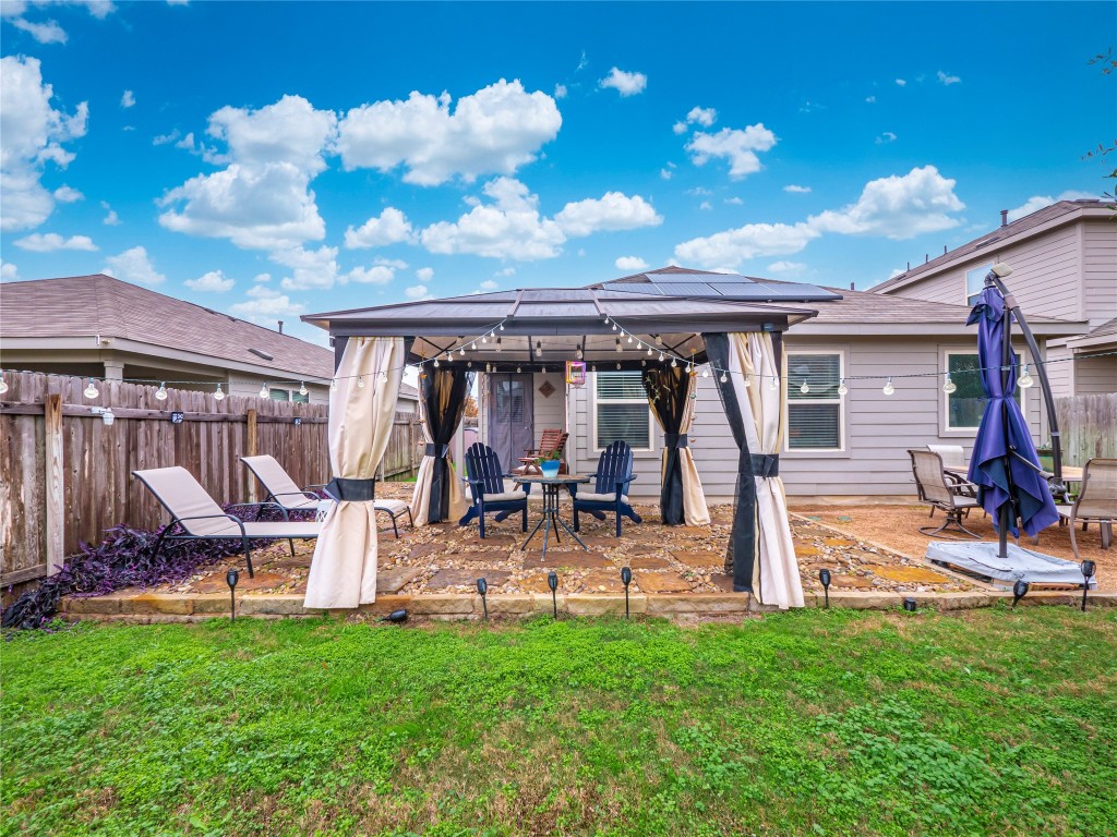 5809 Kennedy Street Austin, TX 78747 - Photo 1 of 1 a view of a house with backyard and sitting area