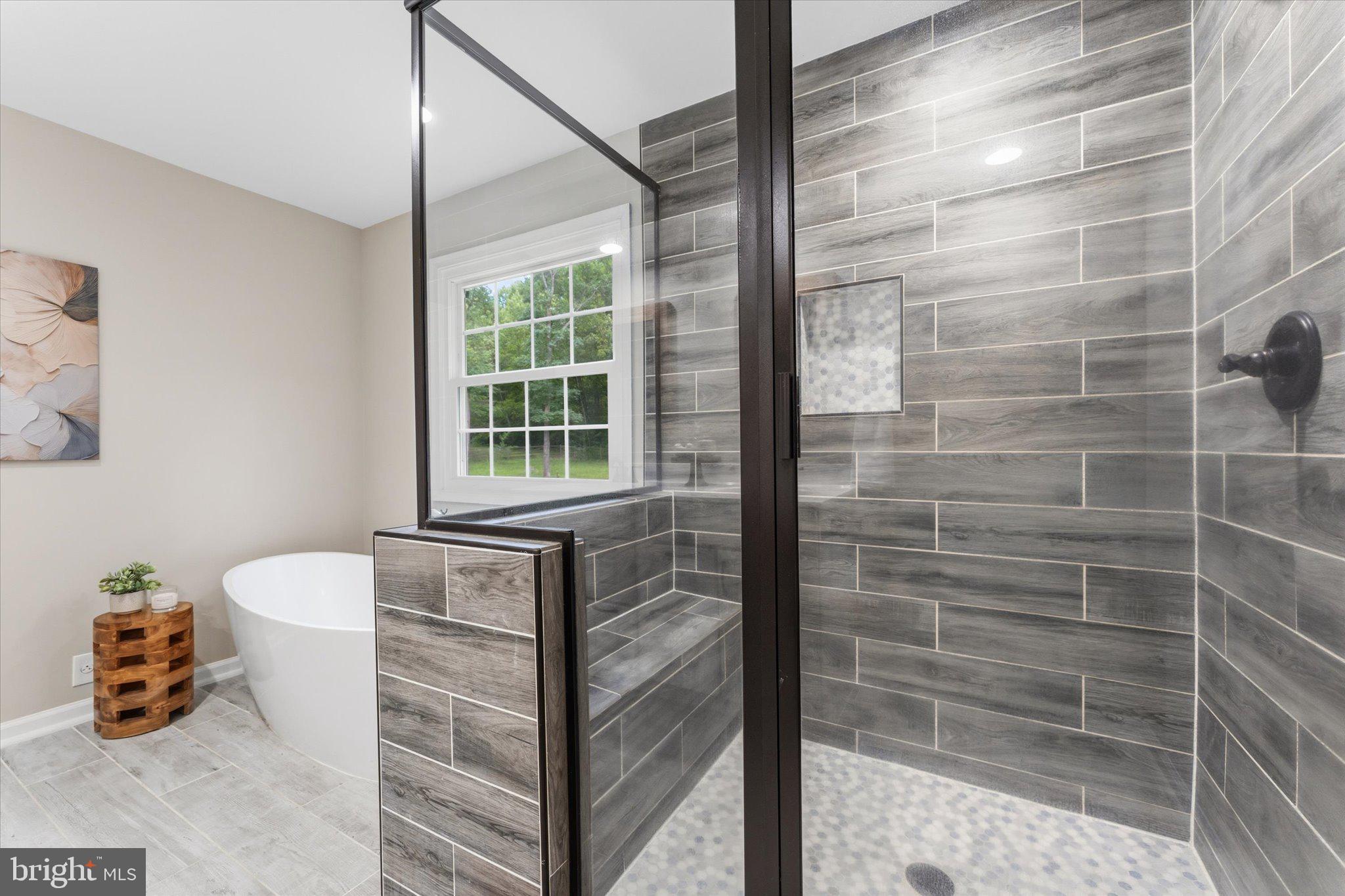8047 Counselor Road Manassas, VA 20112 - Photo 26 of 55 Spa-inspired primary bathroom with modern updates.