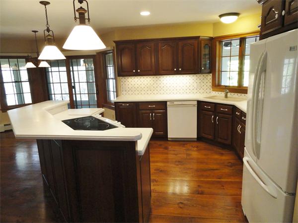 311 Putnam Hill Road Sutton, MA 01590 - Photo 15 of 30 a kitchen with stainless steel appliances granite countertop a sink a stove and a refrigerator