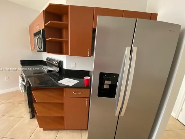 2425 Southwest 27th Avenue, Unit 1008 Miami, FL 33145 - Photo 4 of 20 a bathroom with a sink toilet and mirror