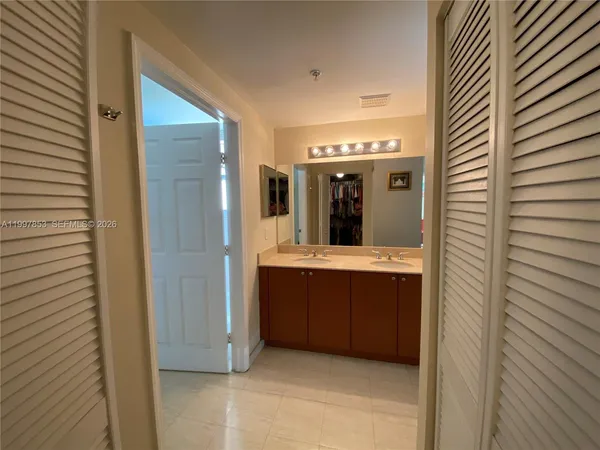 a view of bathroom with dual sinks