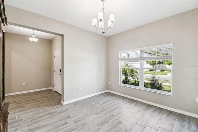 a bathroom with a toilet and a hardwood