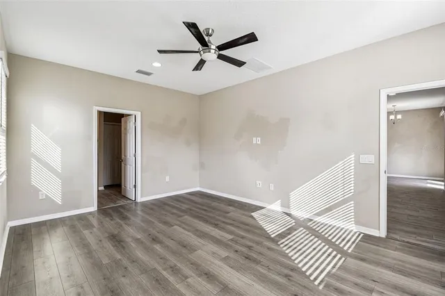 an empty room with a empty space and a window