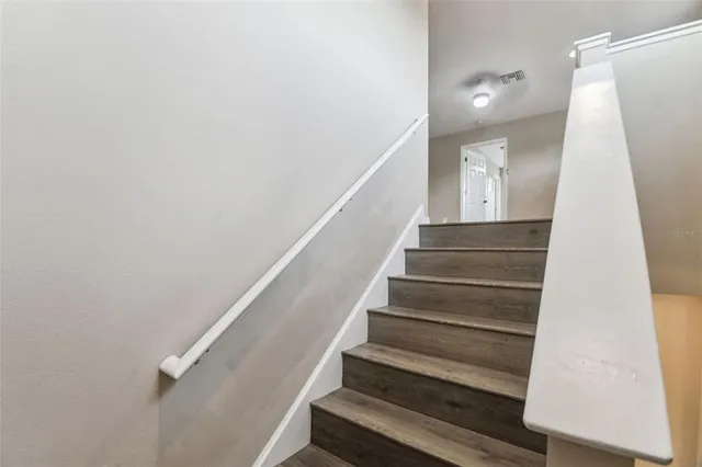 a view of hallway with wooden floor