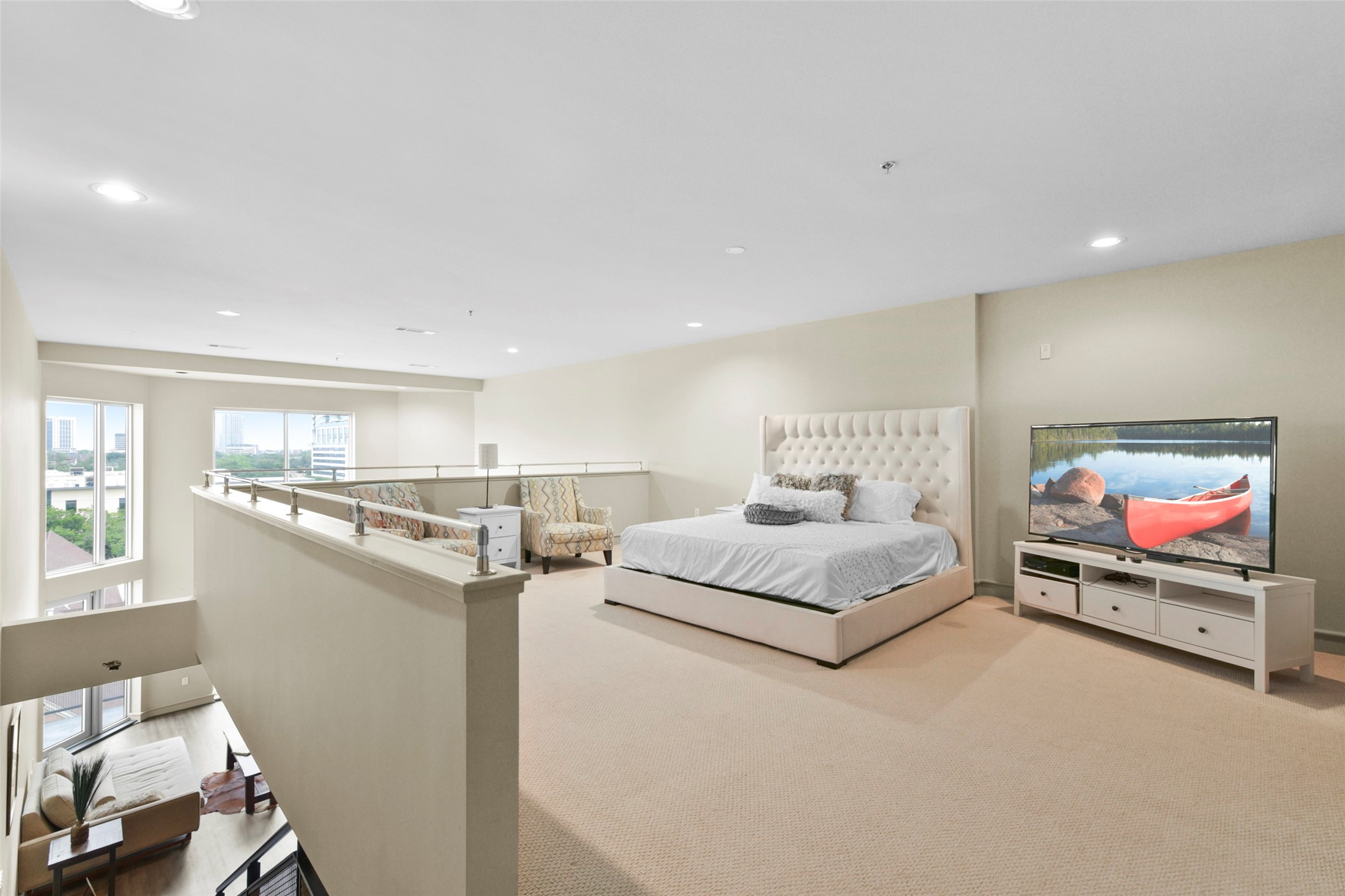 3311 Yupon Street, Unit 611 Houston, TX 77006 - Photo 11 of 17 a living room with furniture and a flat screen tv