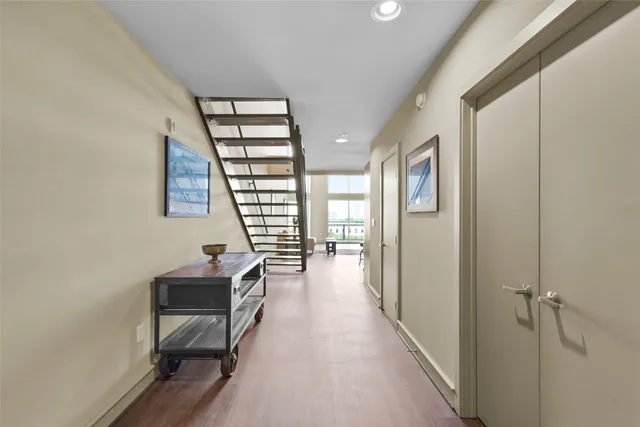 a very nice looking room with a wooden floor and windows