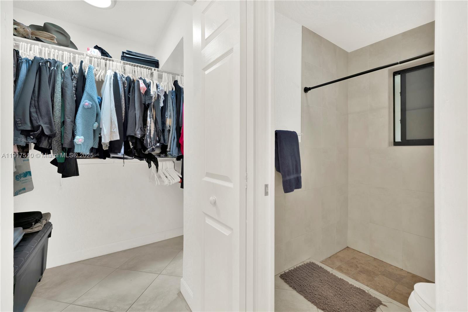 12221 Southwest 93rd Street Miami, FL 33186 - Photo 24 of 42 a view of walk in closet with clothes