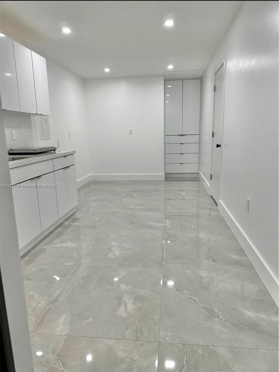 12221 Southwest 93rd Street Miami, FL 33186 - Photo 30 of 41 a view of a kitchen with white cabinets