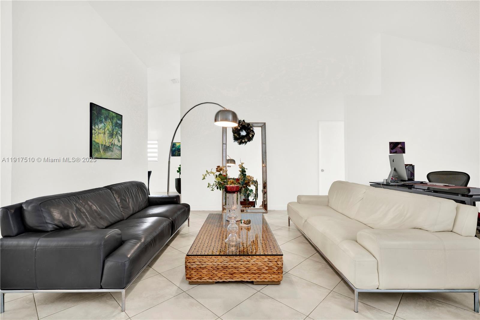 12221 Southwest 93rd Street Miami, FL 33186 - Photo 4 of 41 a living room with furniture and a potted plant