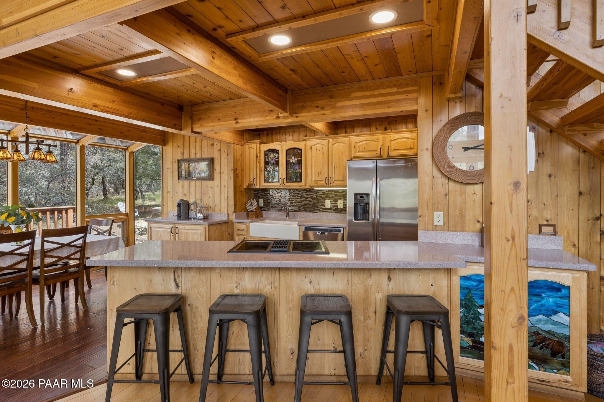 35 East Colonels Way Prescott, AZ 86303 - Photo 13 of 70 a dining table with chairs and kitchen view