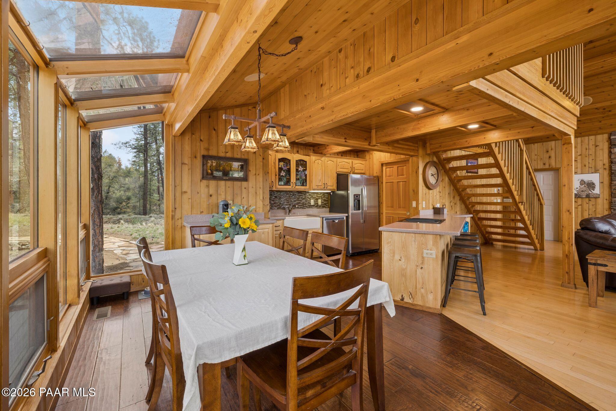 35 East Colonels Way Prescott, AZ 86303 - Photo 18 of 70 a view of a dining room with furniture window and wooden floor