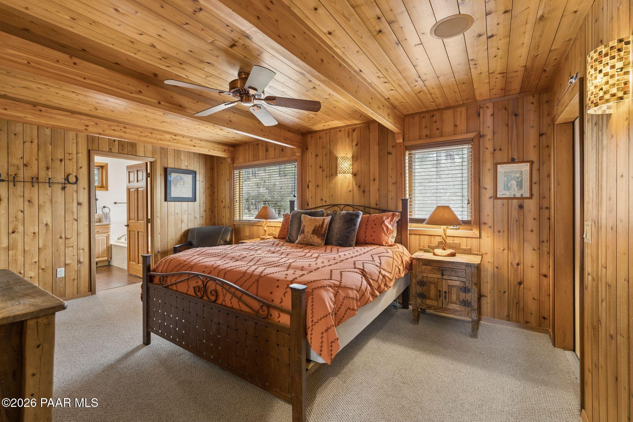 35 East Colonels Way Prescott, AZ 86303 - Photo 26 of 70 a bedroom with a bed and a chandelier