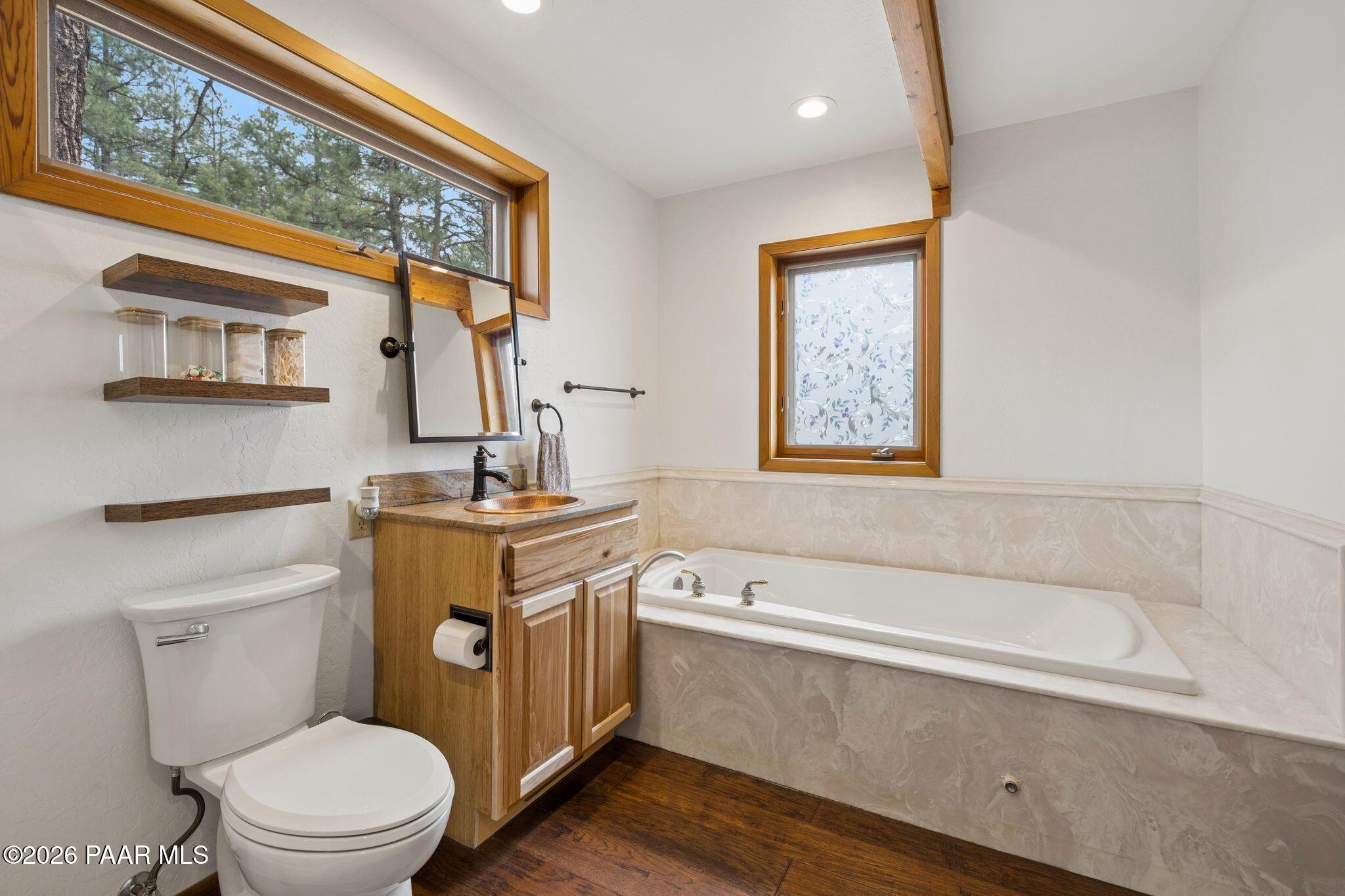 35 East Colonels Way Prescott, AZ 86303 - Photo 29 of 70 a bathroom with a sink a mirror toilet and bathtub