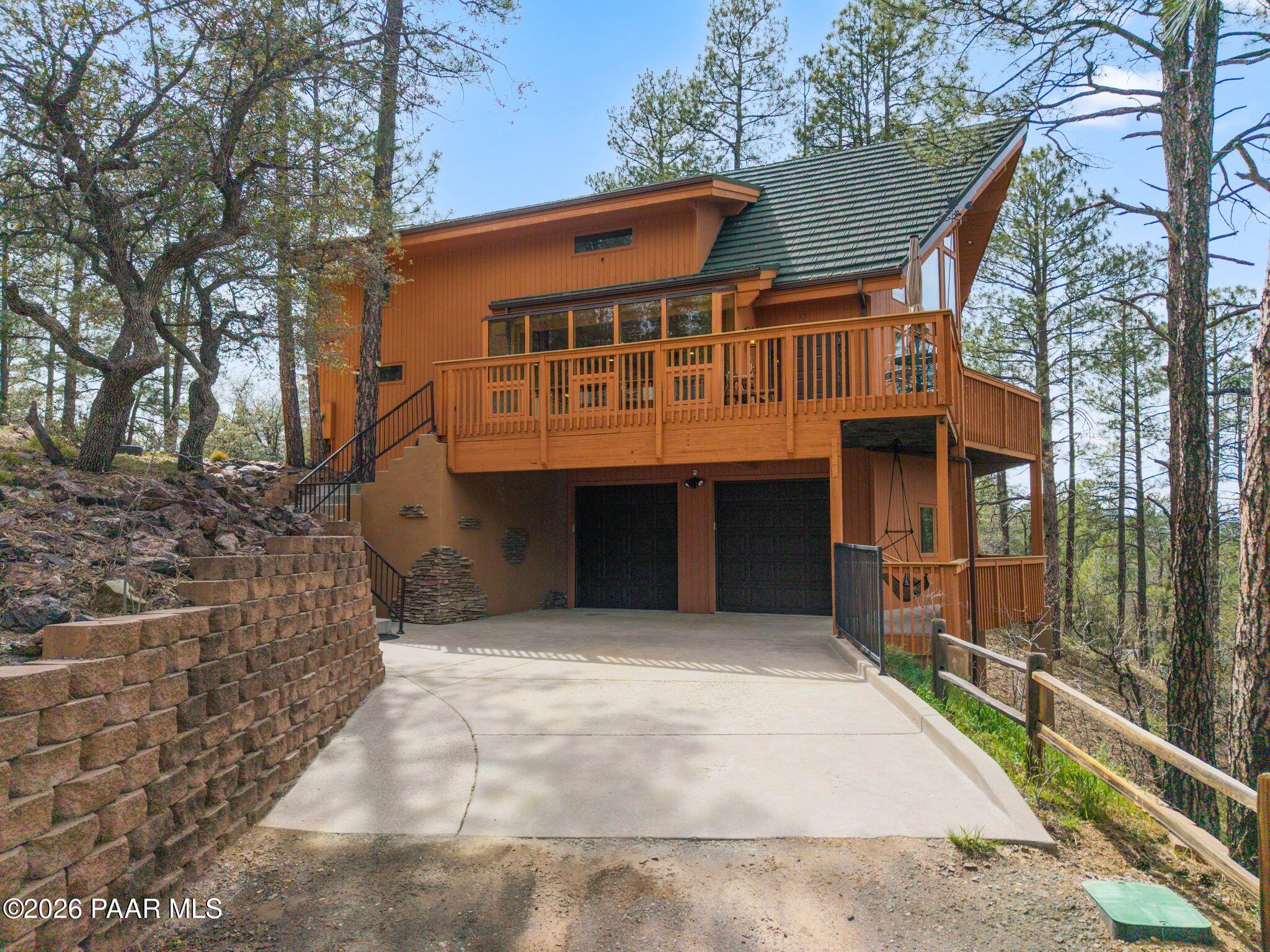35 East Colonels Way Prescott, AZ 86303 - Photo 4 of 70 a front view of a house with a garden