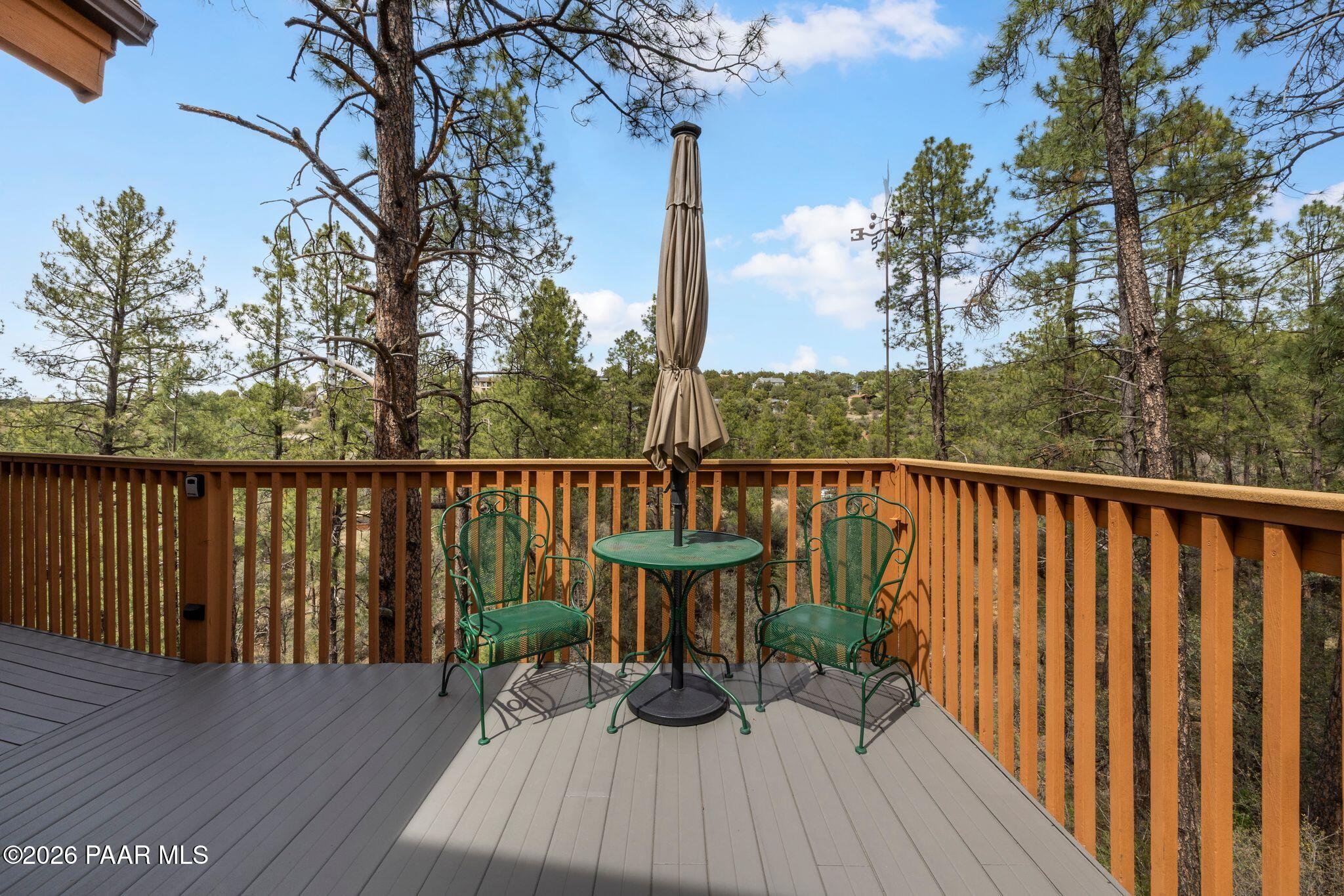 35 East Colonels Way Prescott, AZ 86303 - Photo 48 of 70 a view of a deck with two chair and wooden floor