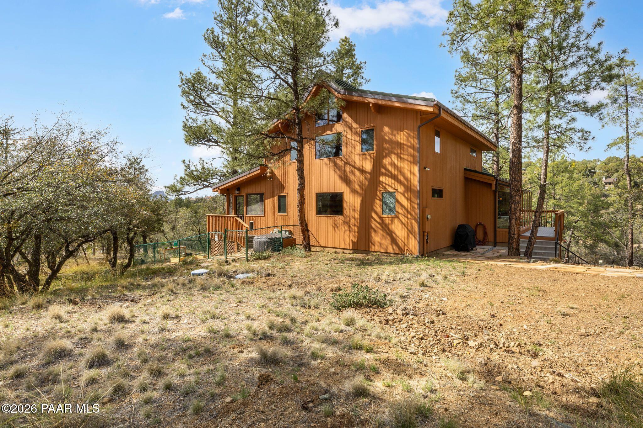35 East Colonels Way Prescott, AZ 86303 - Photo 59 of 70 a backyard of a house with large trees
