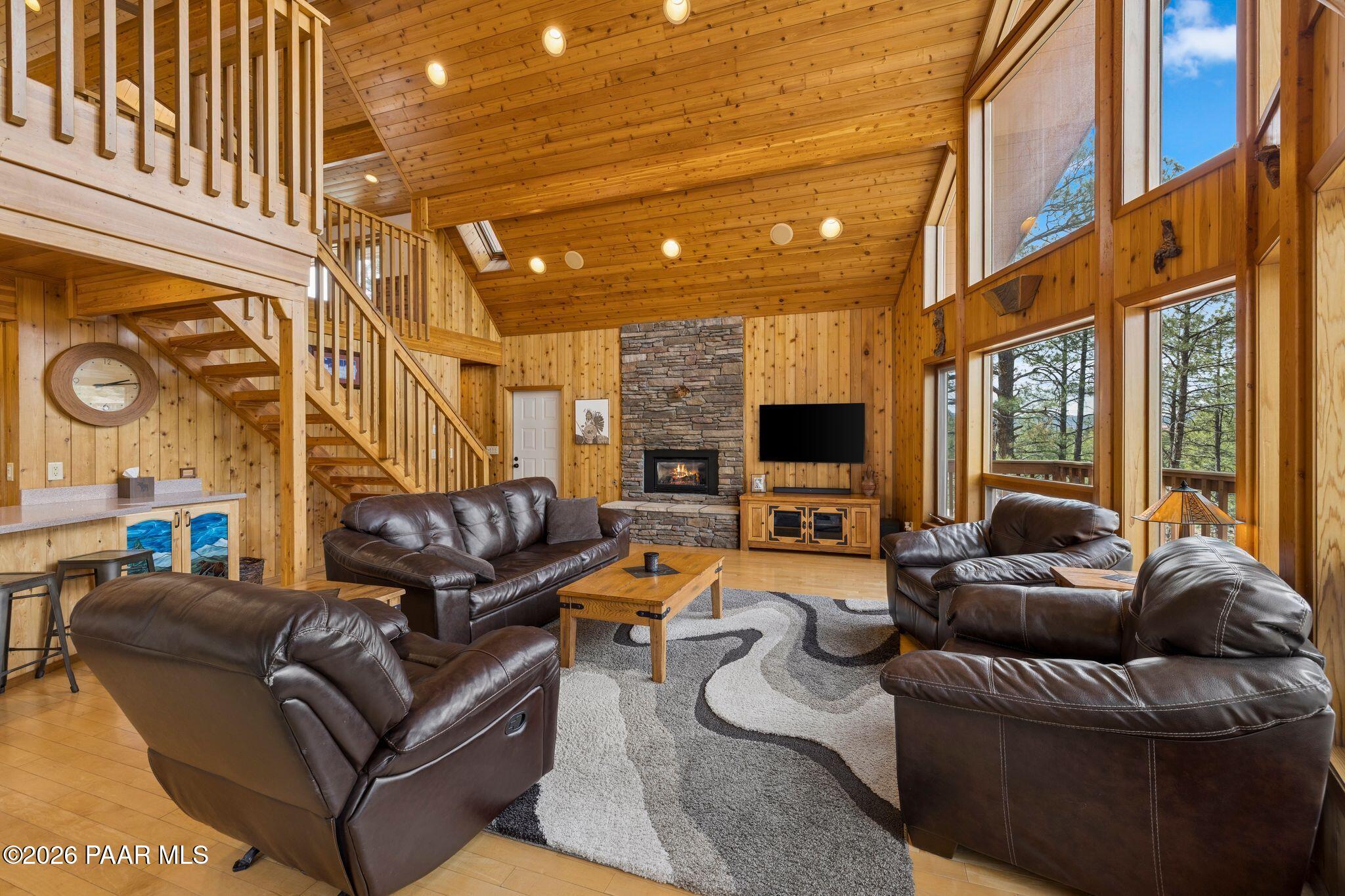 35 East Colonels Way Prescott, AZ 86303 - Photo 6 of 70 a living room with fireplace furniture and a flat screen tv