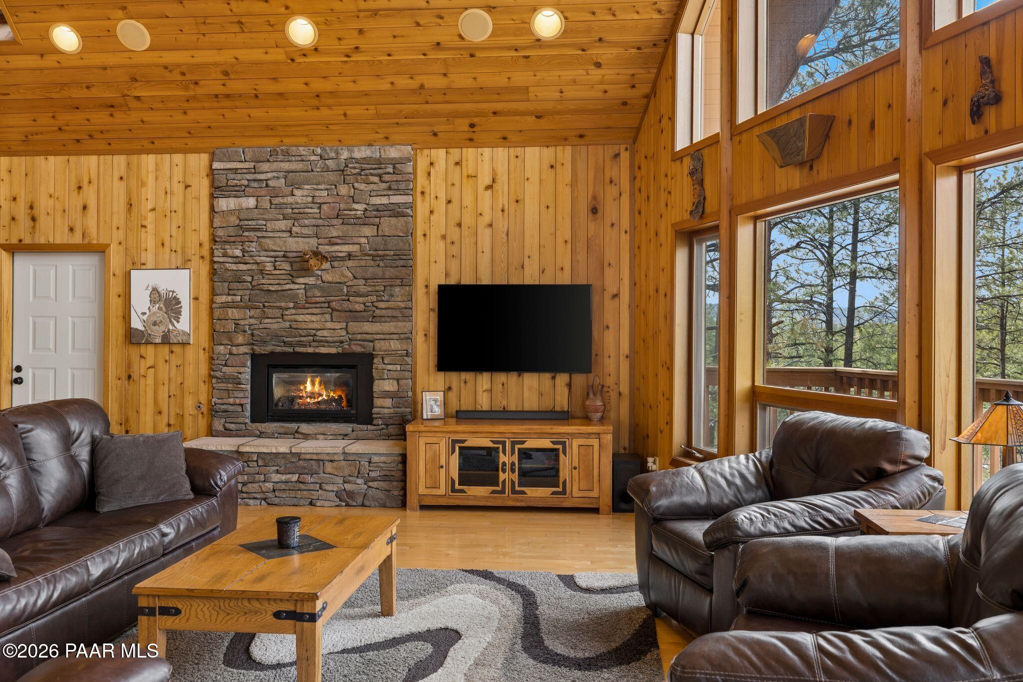 35 East Colonels Way Prescott, AZ 86303 - Photo 10 of 70 a living room with furniture a flat screen tv and a fireplace