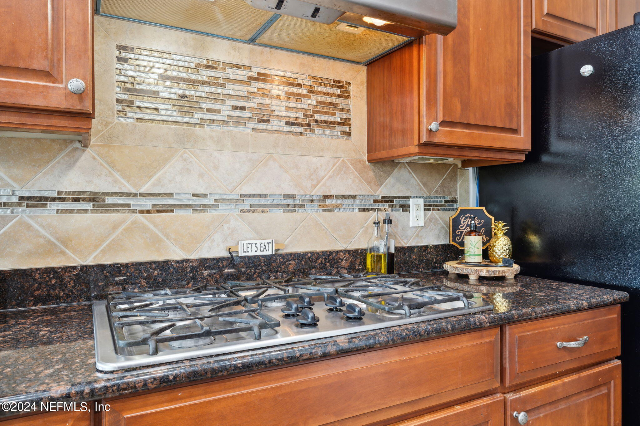 1403 Eagle Crossing Drive Orange Park, FL 32065 - Photo 14 of 71 a kitchen with a stove and a cabinet