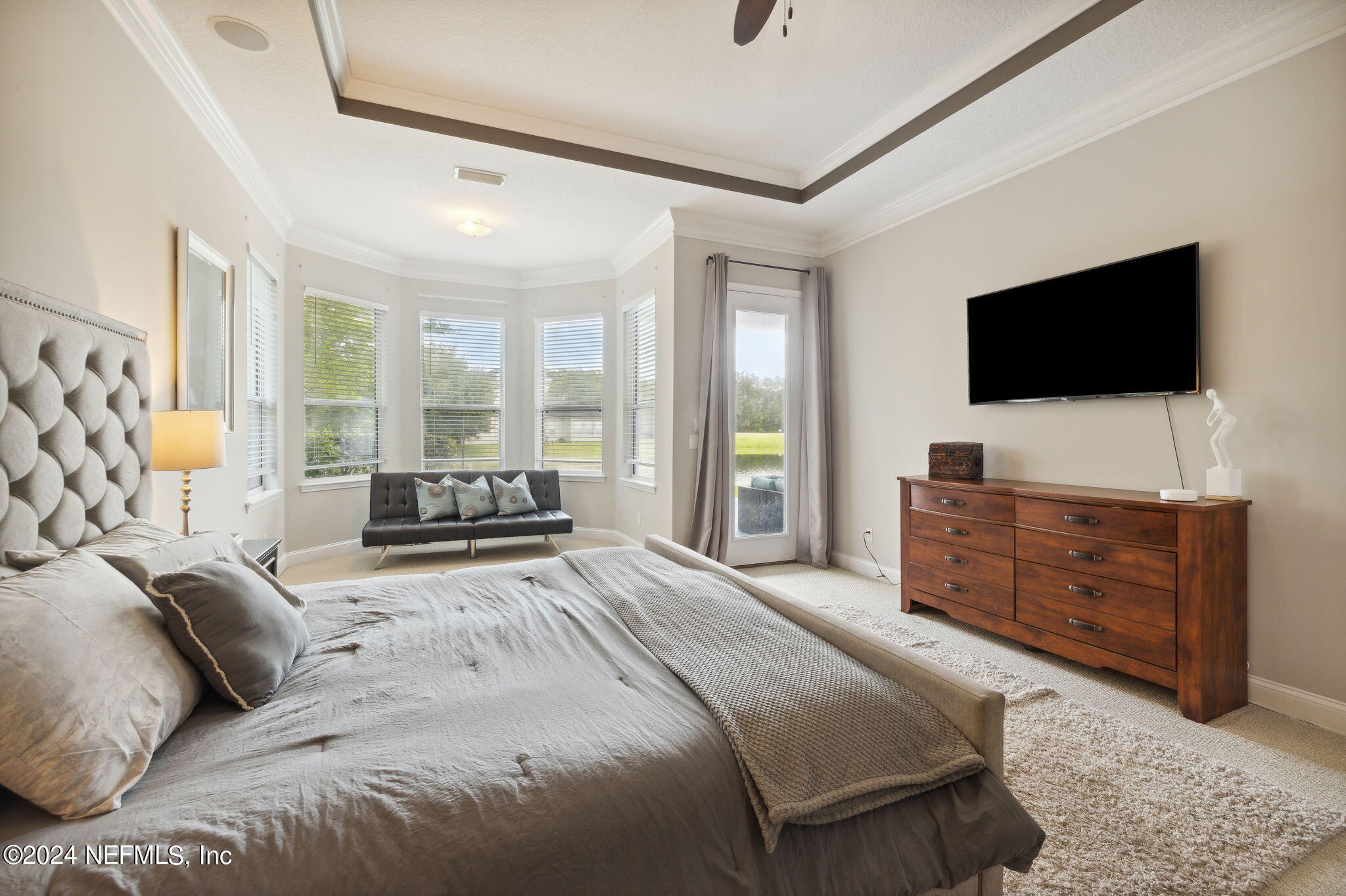 1403 Eagle Crossing Drive Orange Park, FL 32065 - Photo 18 of 71 a bedroom with a large bed and a flat screen tv