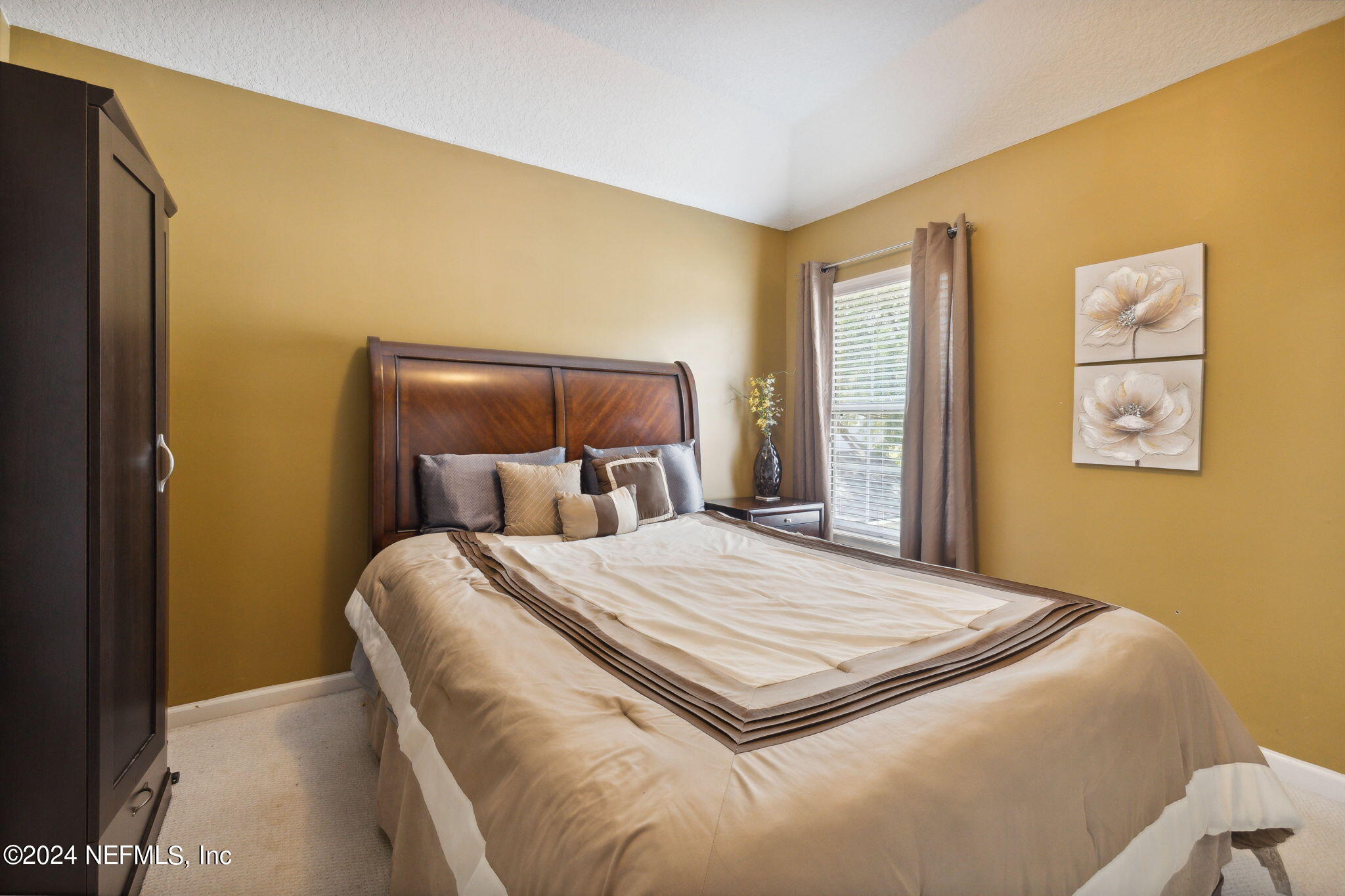 1403 Eagle Crossing Drive Orange Park, FL 32065 - Photo 24 of 71 a bedroom with a bed and painting on the wall