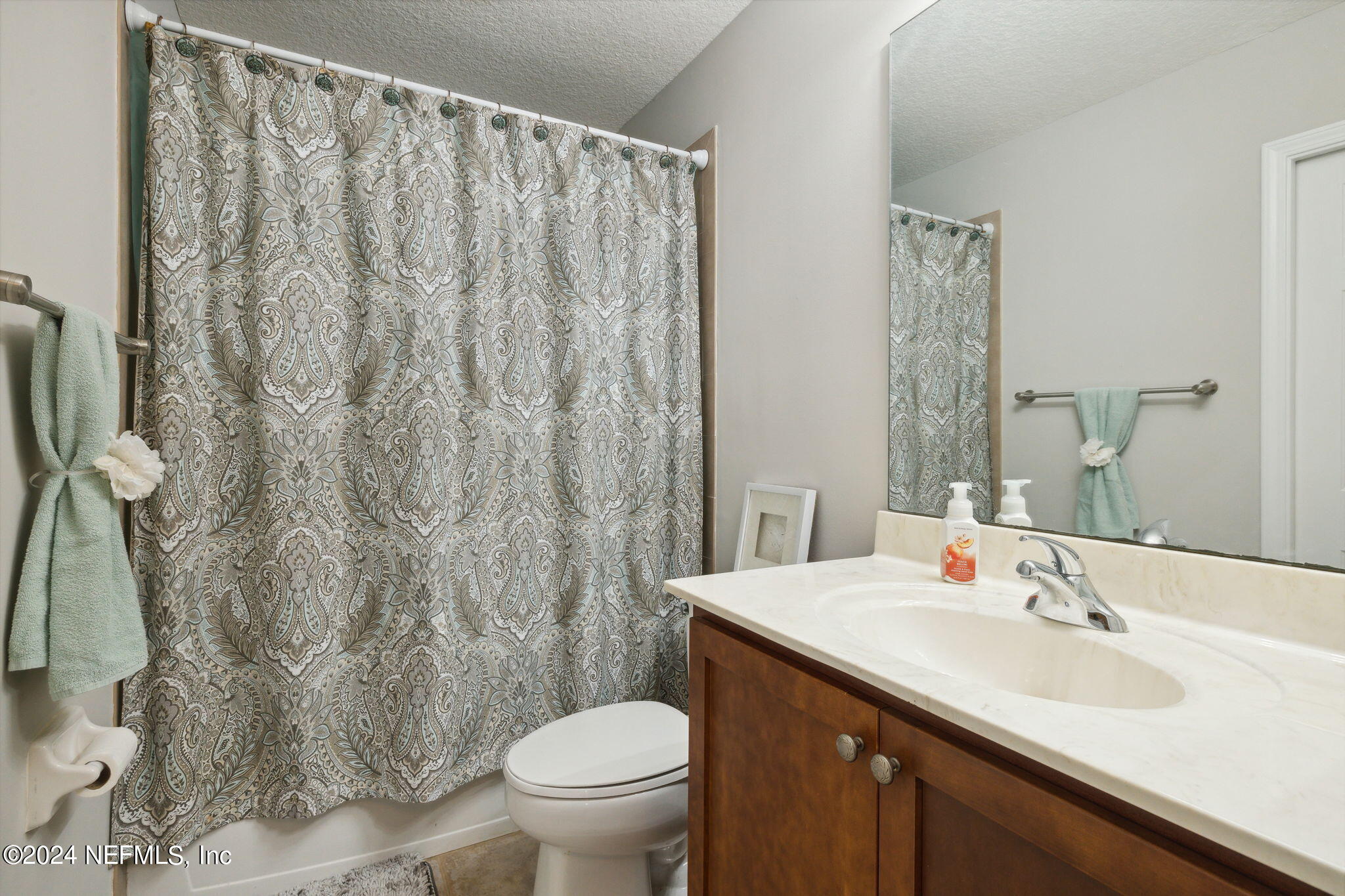 1403 Eagle Crossing Drive Orange Park, FL 32065 - Photo 25 of 71 a bathroom with a granite countertop sink and a toilet