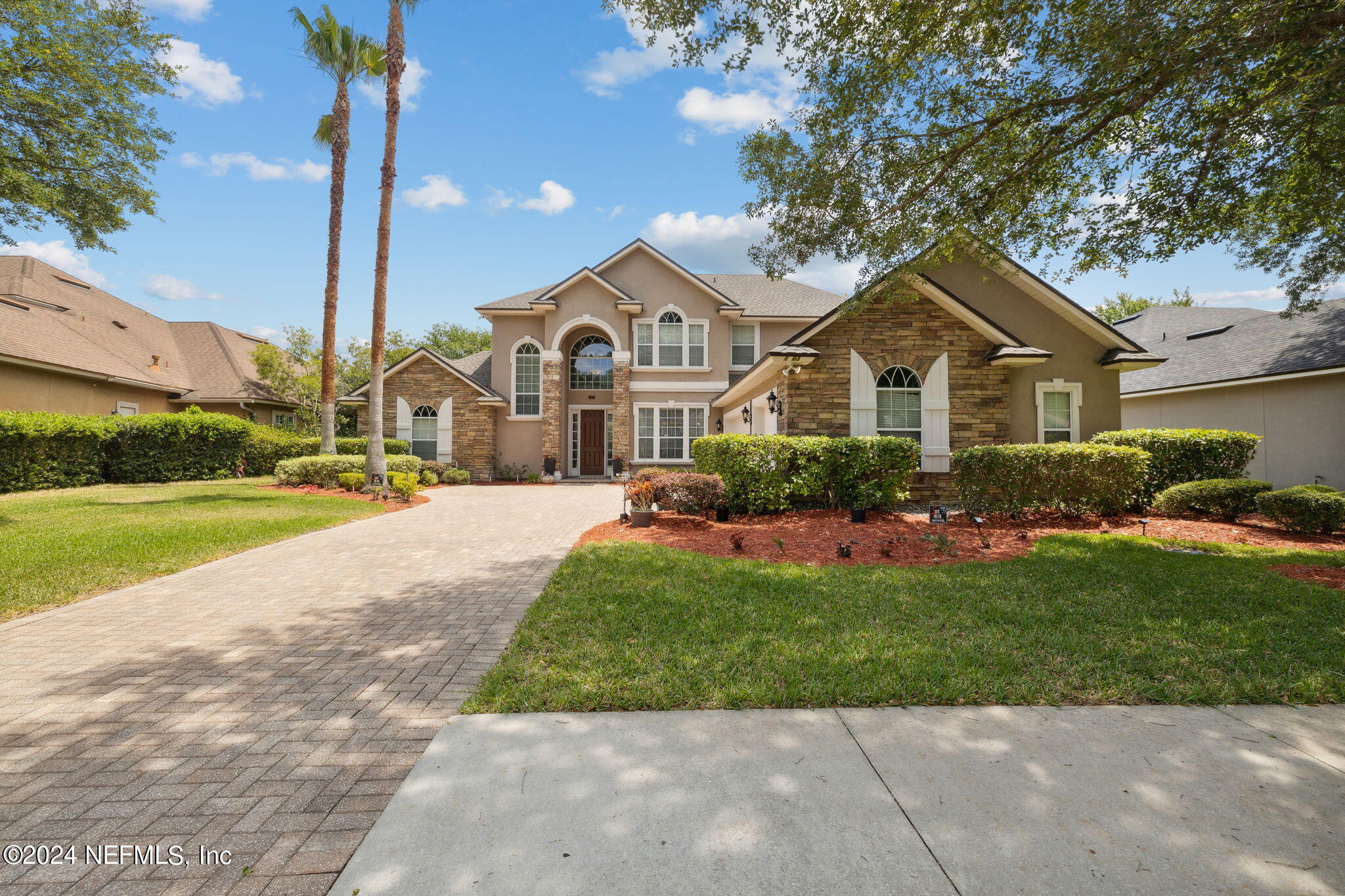 1403 Eagle Crossing Drive Orange Park, FL 32065 - Photo 32 of 71 a front view of a house with a yard and potted plants