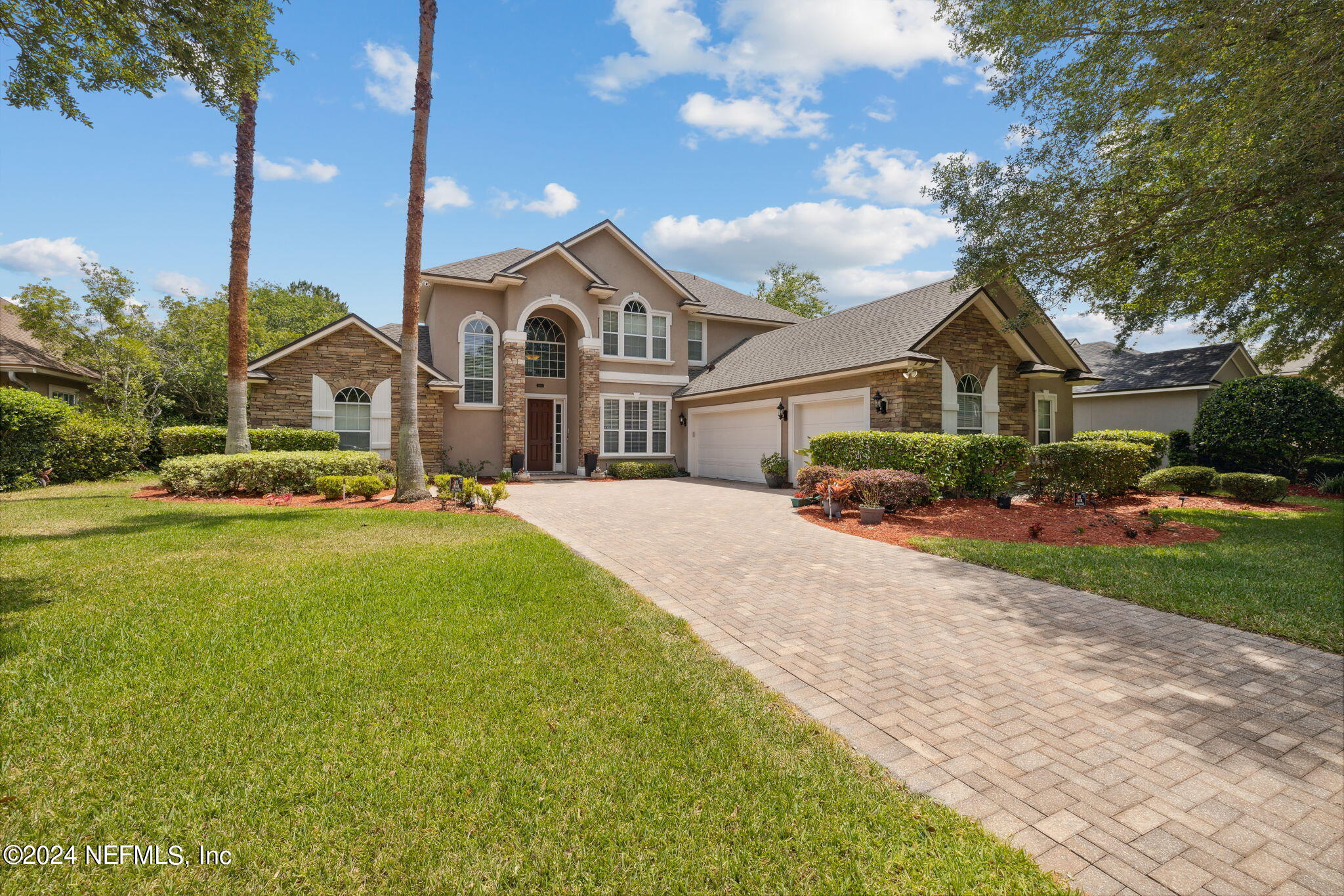 1403 Eagle Crossing Drive Orange Park, FL 32065 - Photo 33 of 71 a front view of a house with a garden and pathway