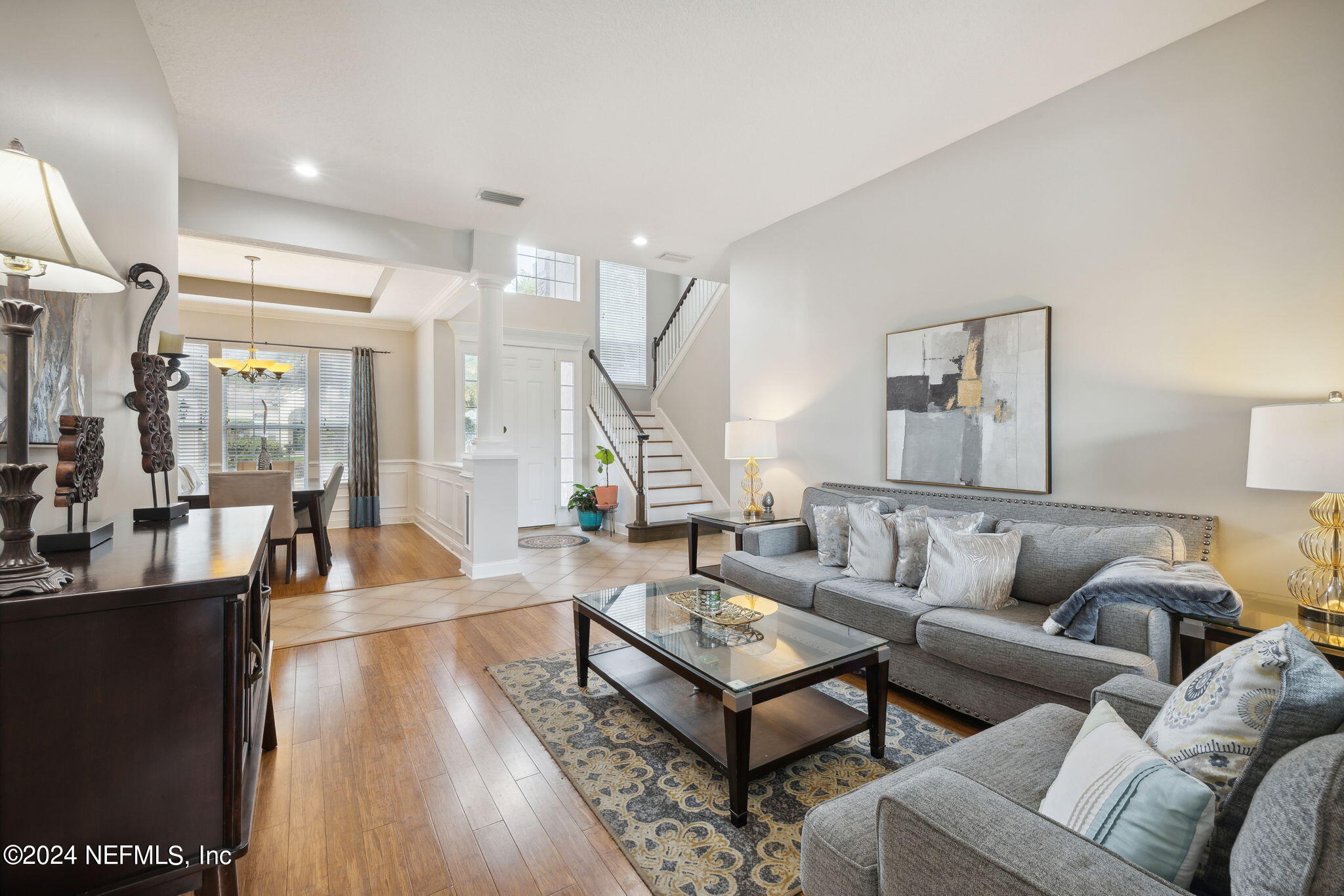 1403 Eagle Crossing Drive Orange Park, FL 32065 - Photo 6 of 71 a living room with furniture wooden floor and a large window
