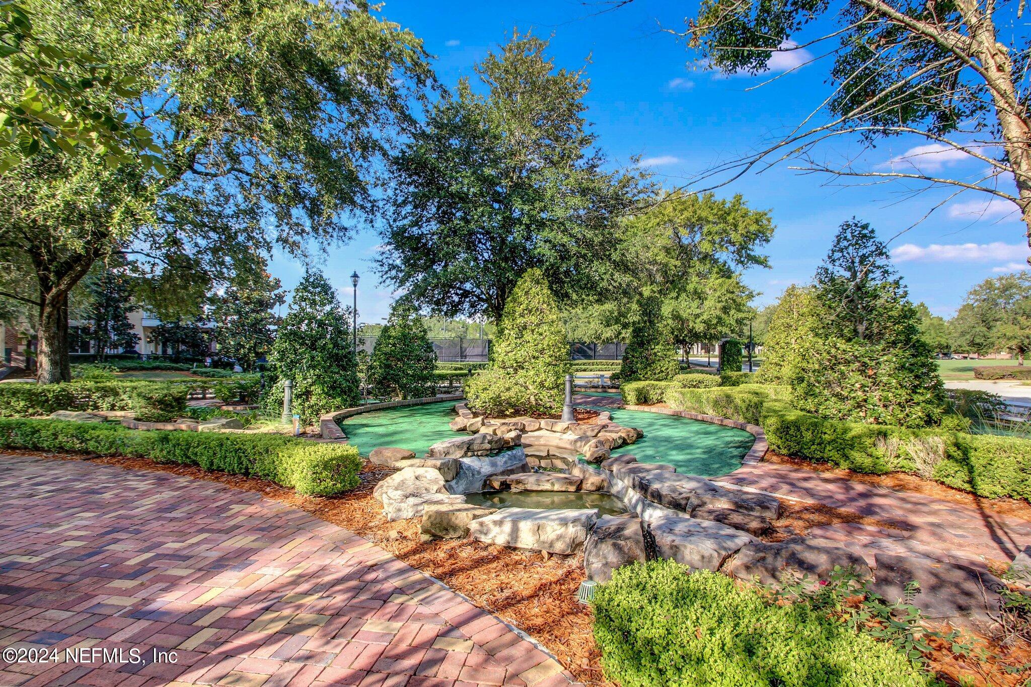 1403 Eagle Crossing Drive Orange Park, FL 32065 - Photo 61 of 71 a view of backyard with outdoor seating and green space