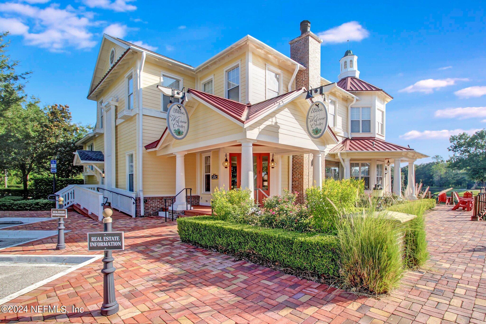 1403 Eagle Crossing Drive Orange Park, FL 32065 - Photo 65 of 71 a front view of a house with garden