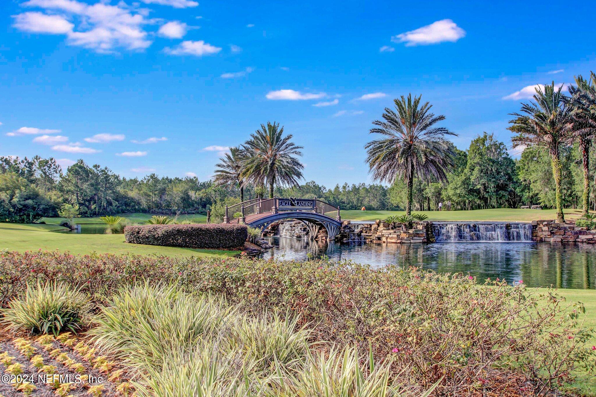 1403 Eagle Crossing Drive Orange Park, FL 32065 - Photo 70 of 71 a view of swimming pool with outdoor seating and lake view
