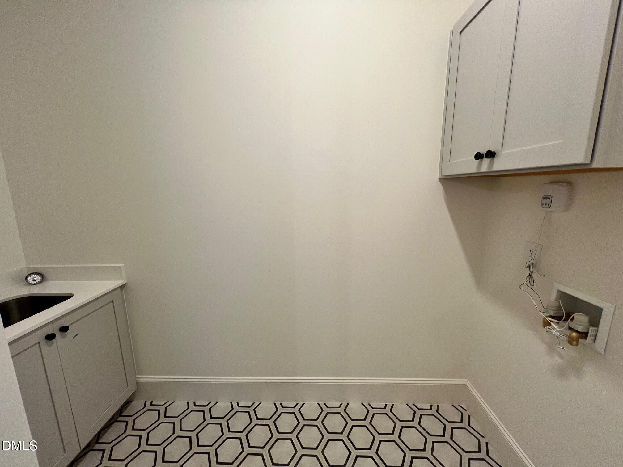 1005 Coldspring Circle Durham, NC 27705 - Photo 11 of 21 a bathroom with a sink and cabinets