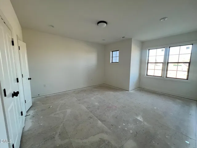 a view of a chandelier fan and wooden floor